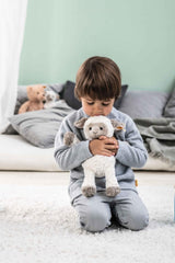 Steiff Lita Lamb with glossy safety eyes for secure, kid-friendly features.