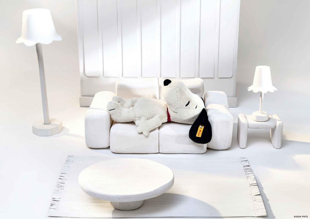 Snoopy plush with embroidered eyes, nose, and mouth for authentic charm.