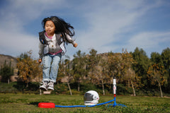 Stomp Rocket Space Shuttle Atlantis soaring during outdoor play