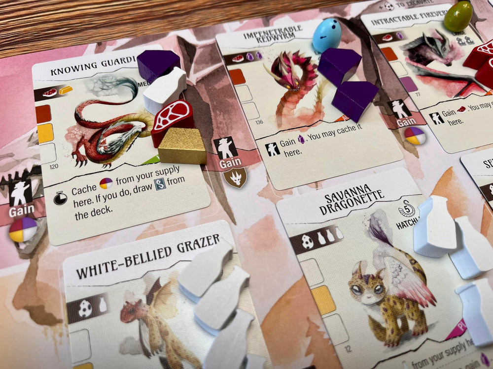 Stonemaier Wyrmspan resources on table showcase vibrant components