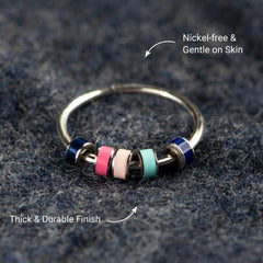 STORYJEWELLERY Spinner Ring in hand demonstrates tactile fidgeting benefit