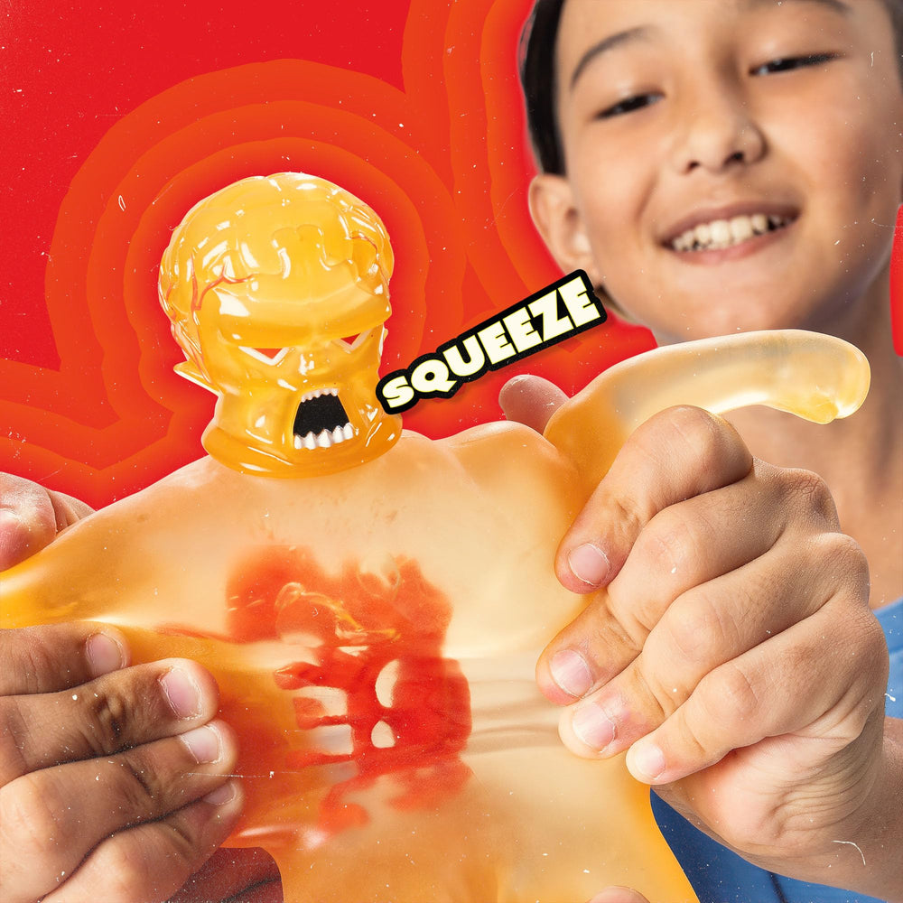 STRETCH ARMSTRONG being stretched wide to show elasticity and durable rebound