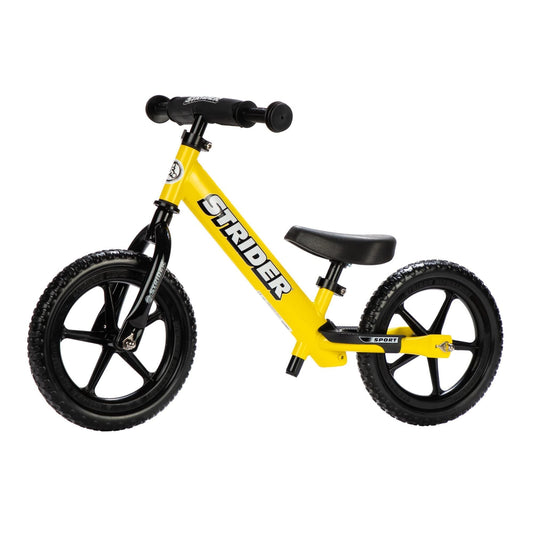 Strider 12-inch Sport Bike yellow, front view, durable balance bike for toddlers.