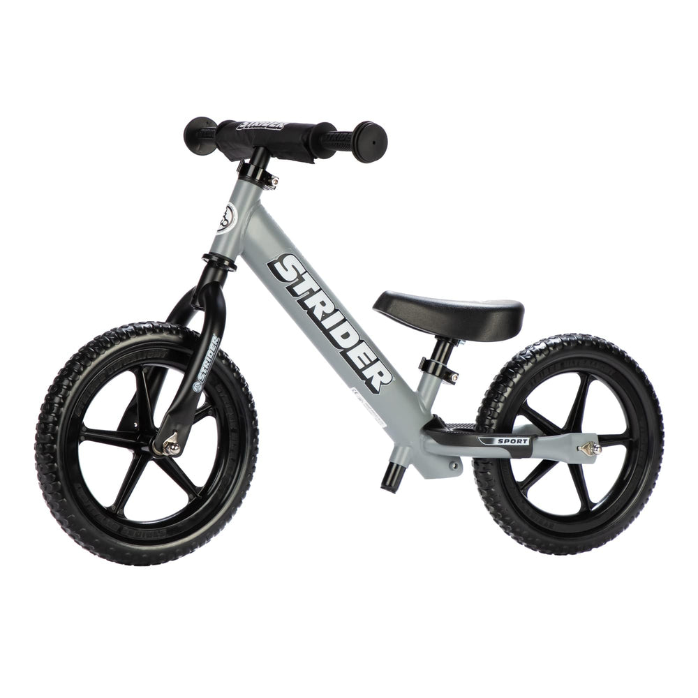Strider 12” Sport Bike matte gray front view showing balance-friendly design