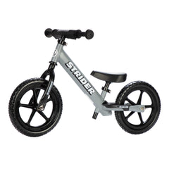 Strider 12” Sport Bike matte gray front view showing balance-friendly design