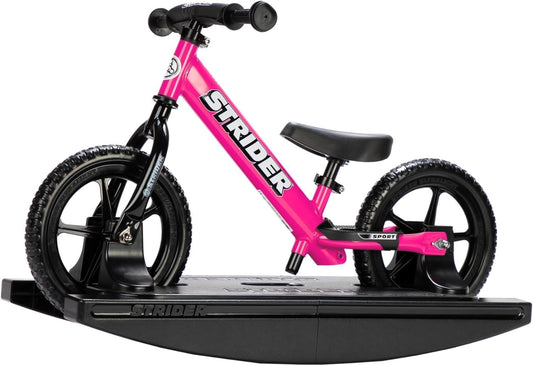Strider 12-inch pink sport bike ready for balance practice with bright color and kid-friendly grips.