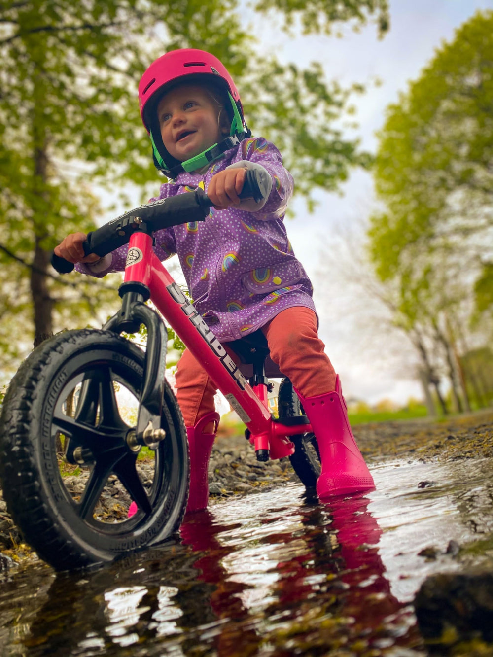 Strider kid on balance bike demonstrates learning through balance and fun.