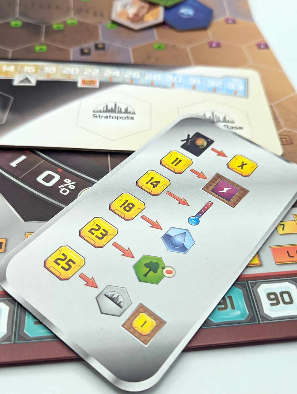 Stronghold Games Terraforming Mars milestones and awards tiles enhance scoring.