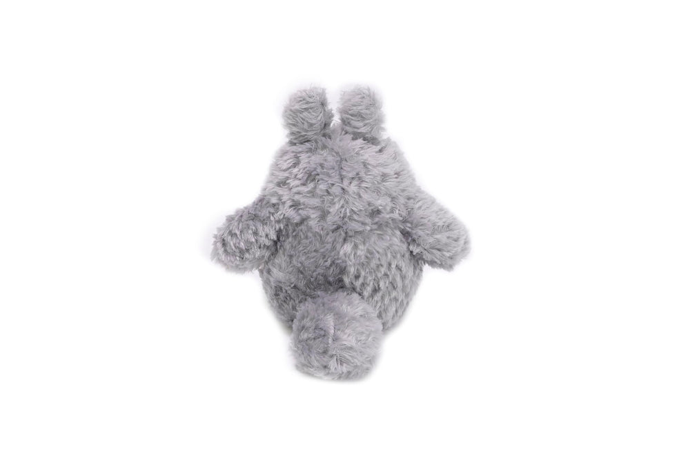 Studio Ghibli Totoro plush resting on a display shelf.