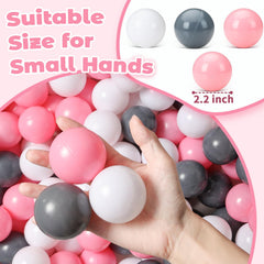 Bright pink, white and grey colors spark imagination during ball pit play for toddlers