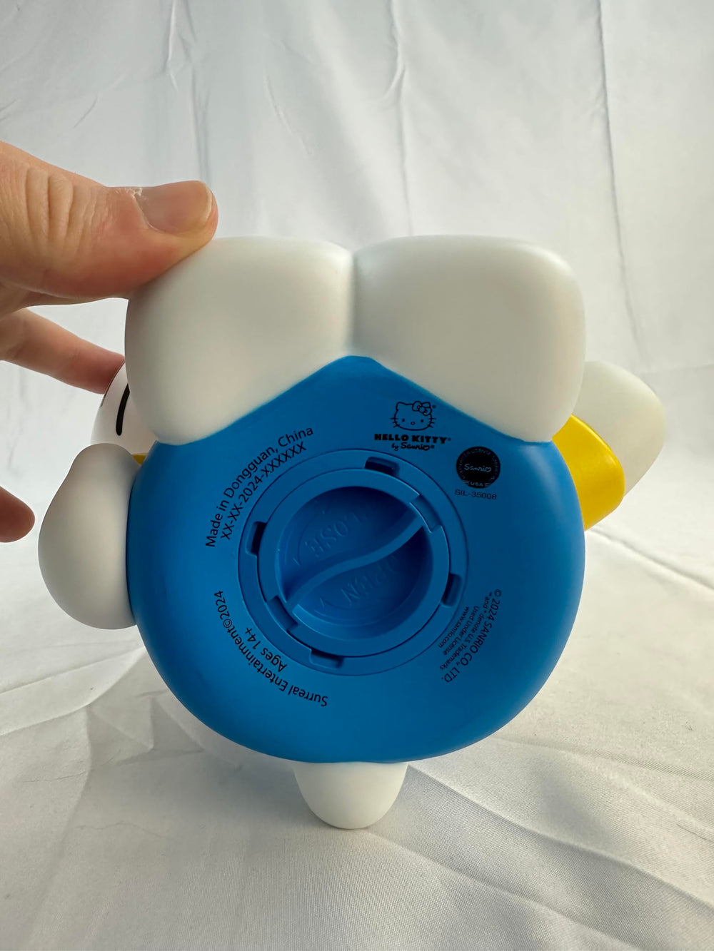 Top coin slot on the Hello Kitty bank makes saving coins easy.