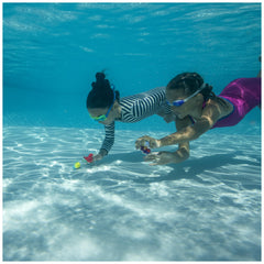 Children enjoying SwimWays Little Mermaid dive characters during pool time