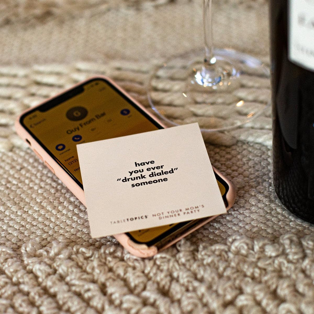 TableTopics provocative questions card prompts candid conversations.