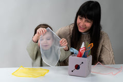 Taf Toys 3D flower detail supports touch development and visual focus.