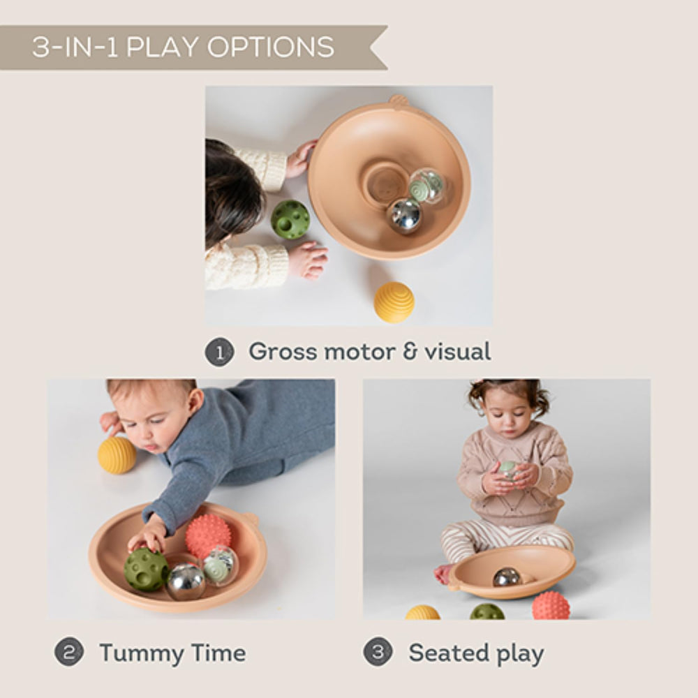 Taf Toys baby tray interaction depicts reaching and pushing to boost hand-eye coordination.