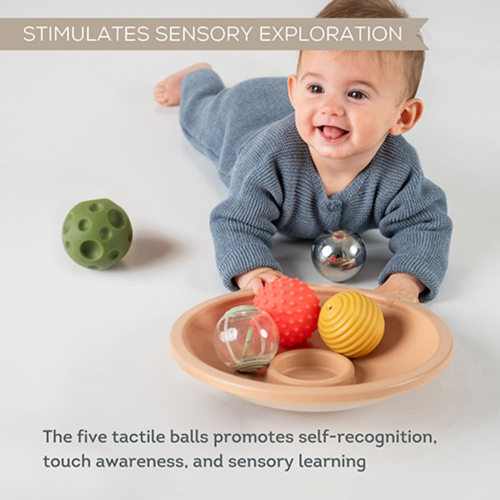 Taf Toys tray swaying motion demonstrates a soothing surface for tummy time activities.