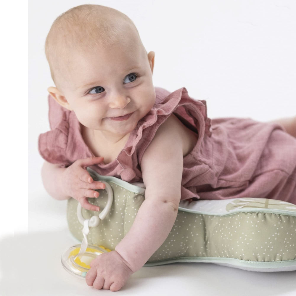 Baby interaction with Taf Toys cushion and interactive toys during play