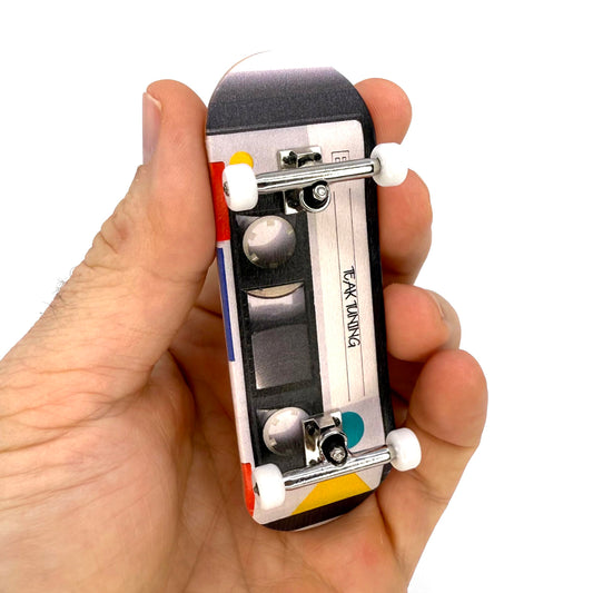 Teak Tuning Cassette Tape graphic fingerboard deck for stylish sessions