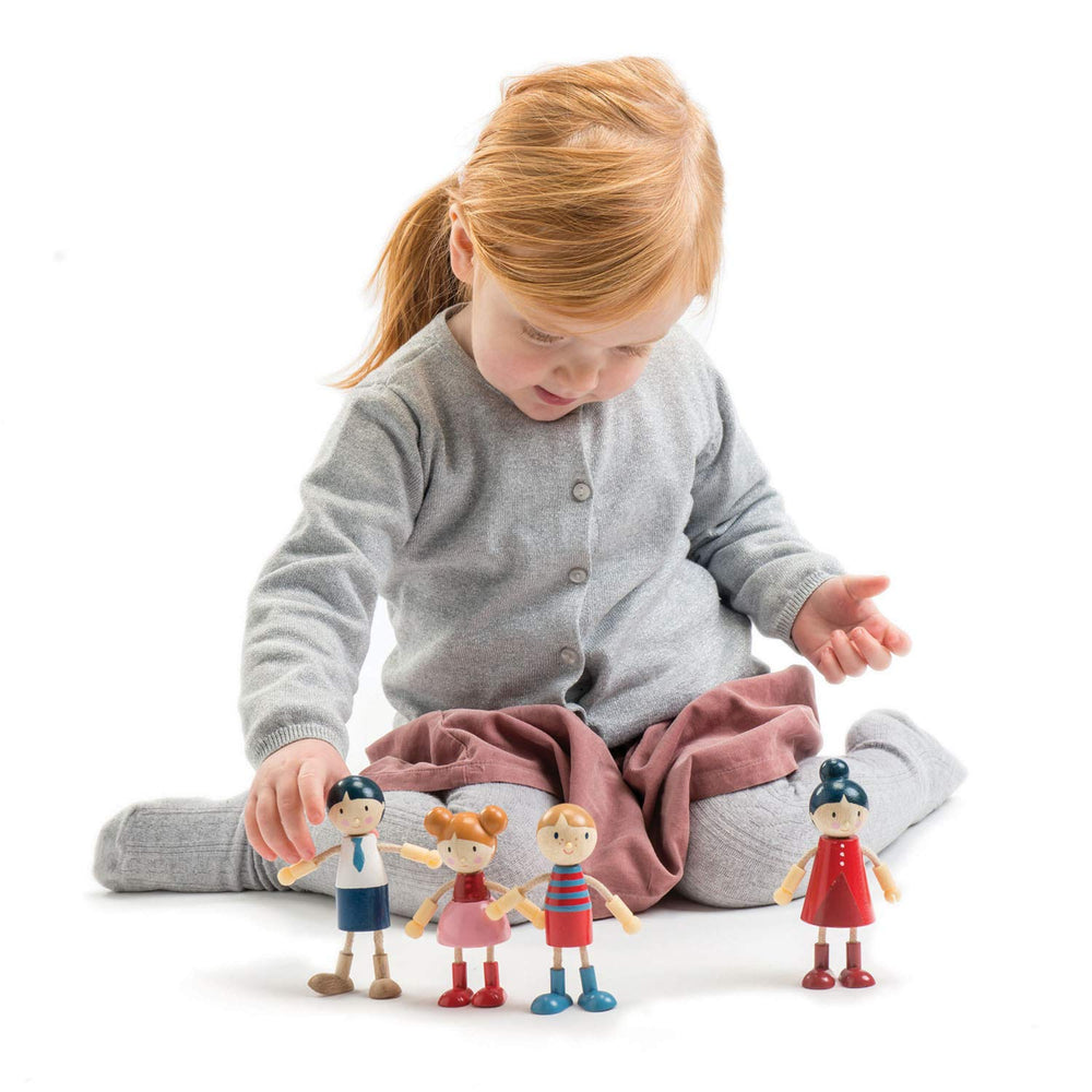 Tender Leaf Toys wooden dolls with flexible limbs for varied poses.