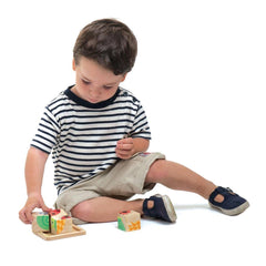 Wooden puzzle blocks forming four animals by Tender Leaf Toys