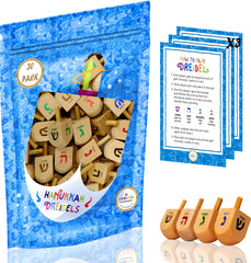 The Dreidel Company 25-pack natural wood dreidels ready for Hanukkah play.