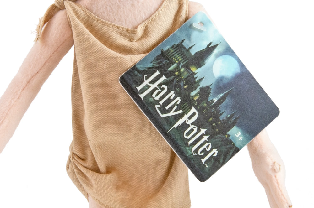The Noble Collection Dobby plush in a sitting pose for cozy display.