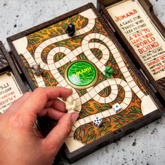 Side-angle shot of the Jumanji miniature board highlighting thickness.