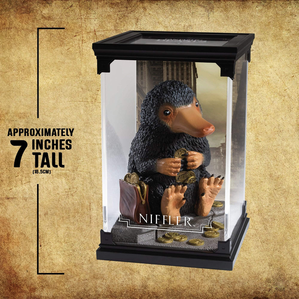The Noble Collection Niffler display case keeps the figure protected.