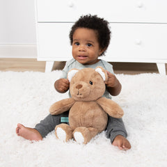 The Peanutshell Benny bear enhances woodland nursery decor with softness