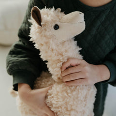 The Petting Zoo alpaca plushie features durable stitching for everyday play.