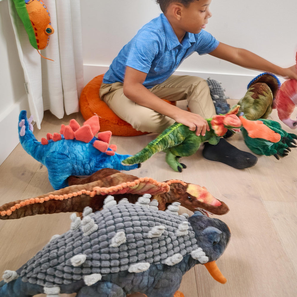 Soft plush texture of The Petting Zoo Ankylosaurus invites friendly hugging.