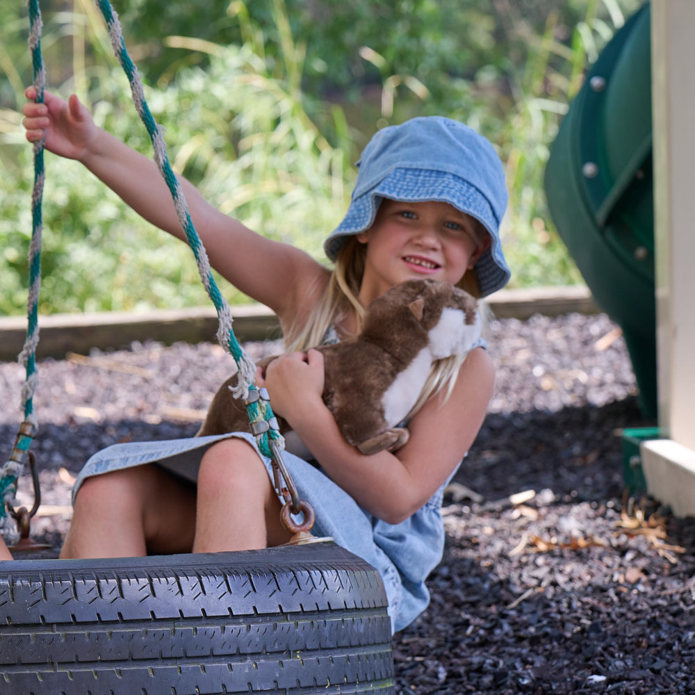 Durable stitching detail supports years of adventures and hugs.