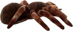 The Petting Zoo tarantula plush shown as a playful, portable companion.