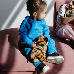 The Petting Zoo tiger keen gaze enhances storytelling and nature-themed pretend adventures.