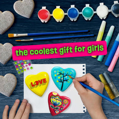 Child painting with The Scholar Ant Hearts Rock Kit during a craft session