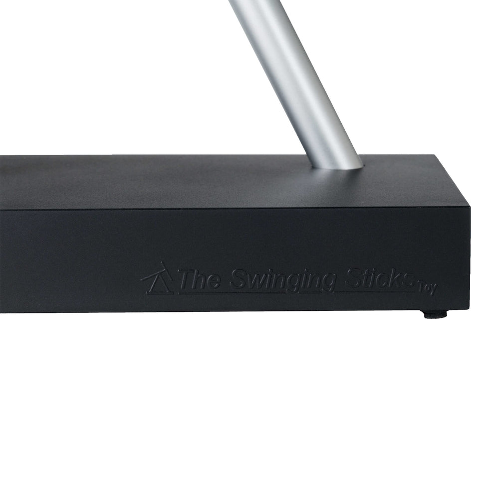 The Swinging Sticks museum-style art adds a sophisticated centerpiece to any office.