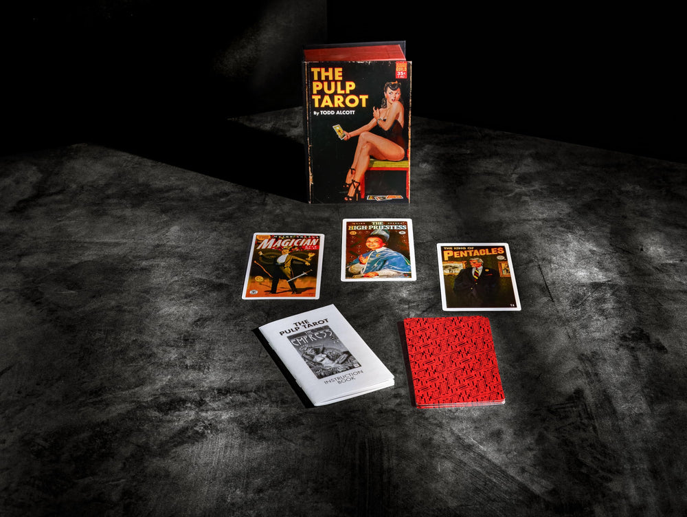Box display of The Pulp Tarot on a coffee table for conversation starters.