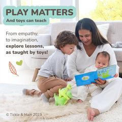 Tickle & Main dinosaur plush close-up showcasing soft cotton fabric and child-friendly safety.