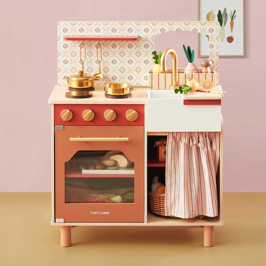 Tiny Land play kitchen assembled in a warm wooden finish for imaginative play