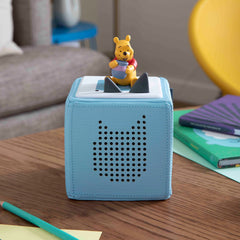 Child listening to Winnie the Pooh stories on Toniebox