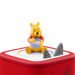 Winnie the Pooh figure beside a Toniebox for easy listening