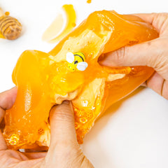 Tototang fake bee charm shown with honey-themed slime and accessories.
