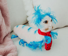 Toy Vault The Worm from Labyrinth plush in-bed snuggle scene emphasizes comforting softness.