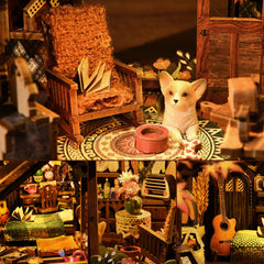 TOYQI Book Nook Kit fireplace glow adds warm ambiance on your desk.