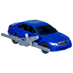 Wheeljack Que blaster accessory attaches for authentic display and action.