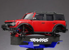 Traxxas 8796 blue RC stand deployed on a workbench for quick maintenance.