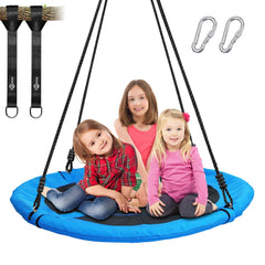 Trekassy saucer swing attached to a tree with straps for sturdy outdoor fun.
