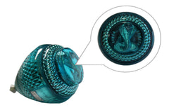 Trompo Cometa Cobrita open-string storage design for quick string replacement.