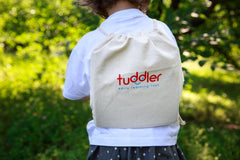 Tuddler drawstring backpack pictured for easy storage and portability.