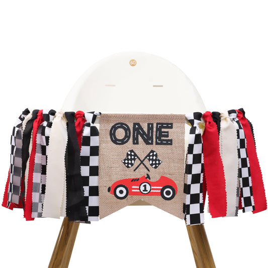 TUTOTU Race Car One high chair banner attached to the chair for a festive first birthday.